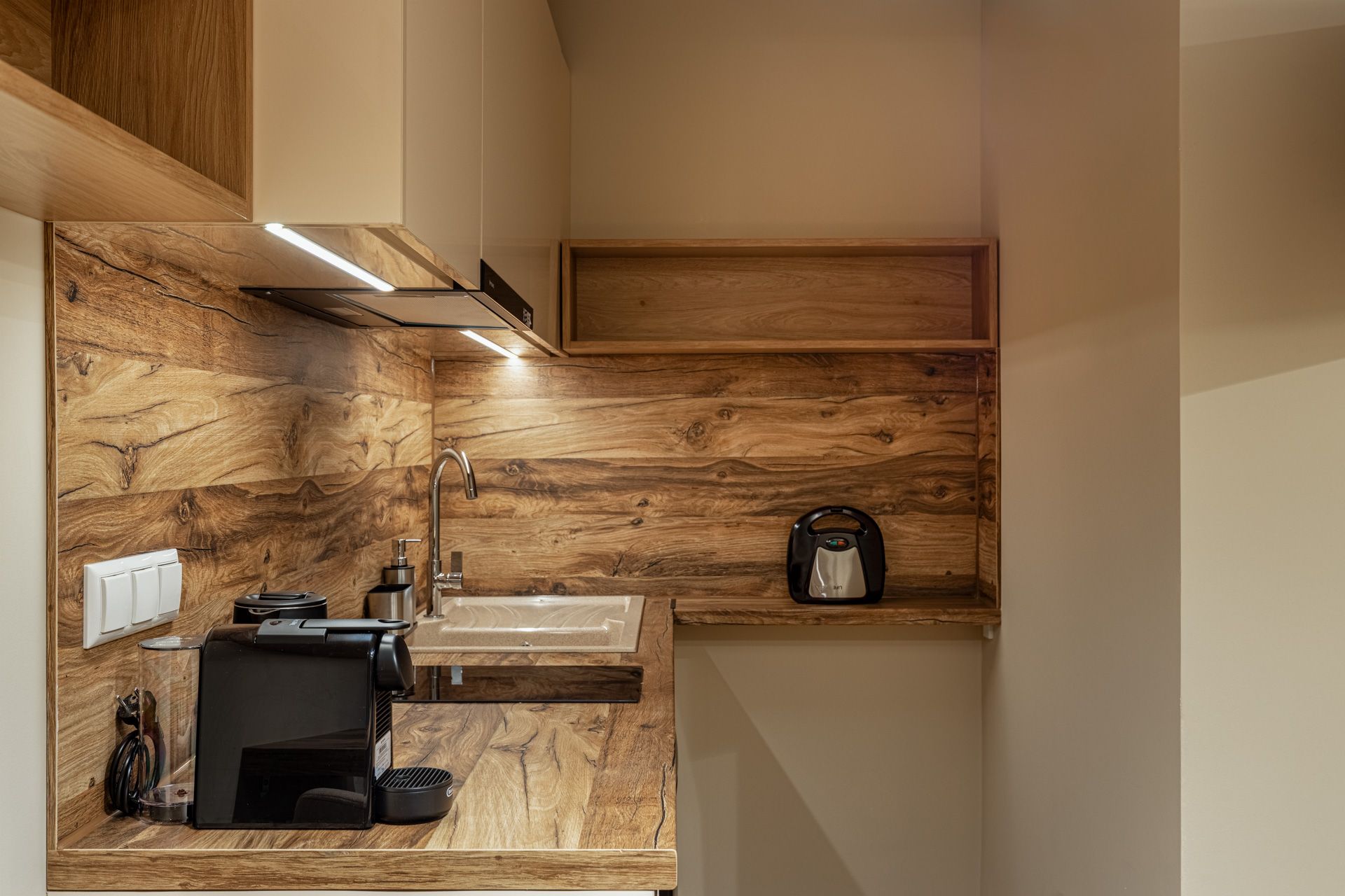 The oak kitchen counter in Anemoessa, with the Nespresso machine and sink