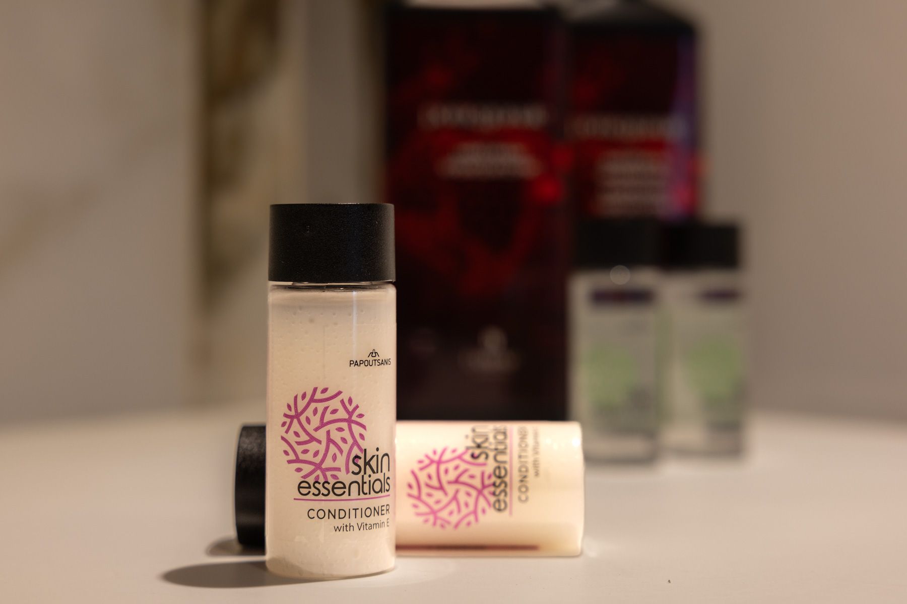 Personal-care bottles on Anemoessa's bathroom shelf
