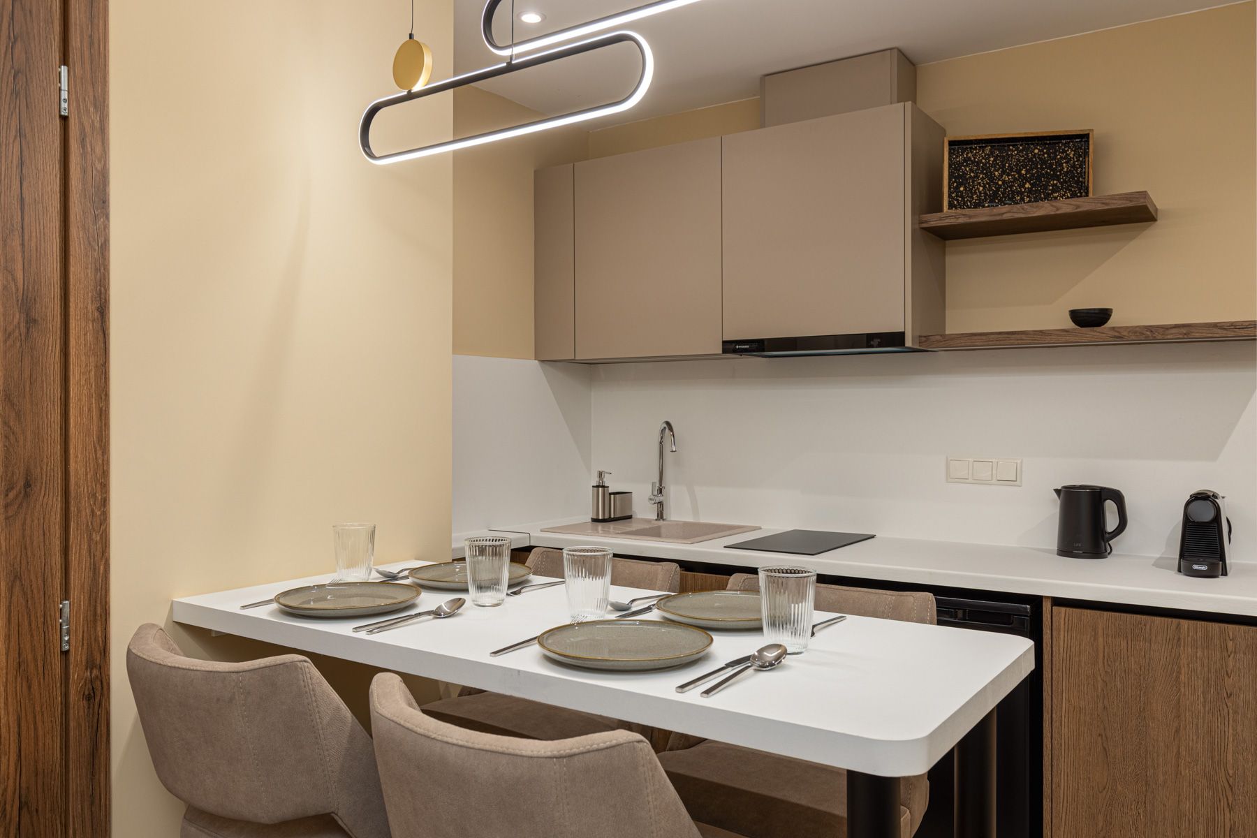 The table in Asteroessa laid for four beside the kitchen