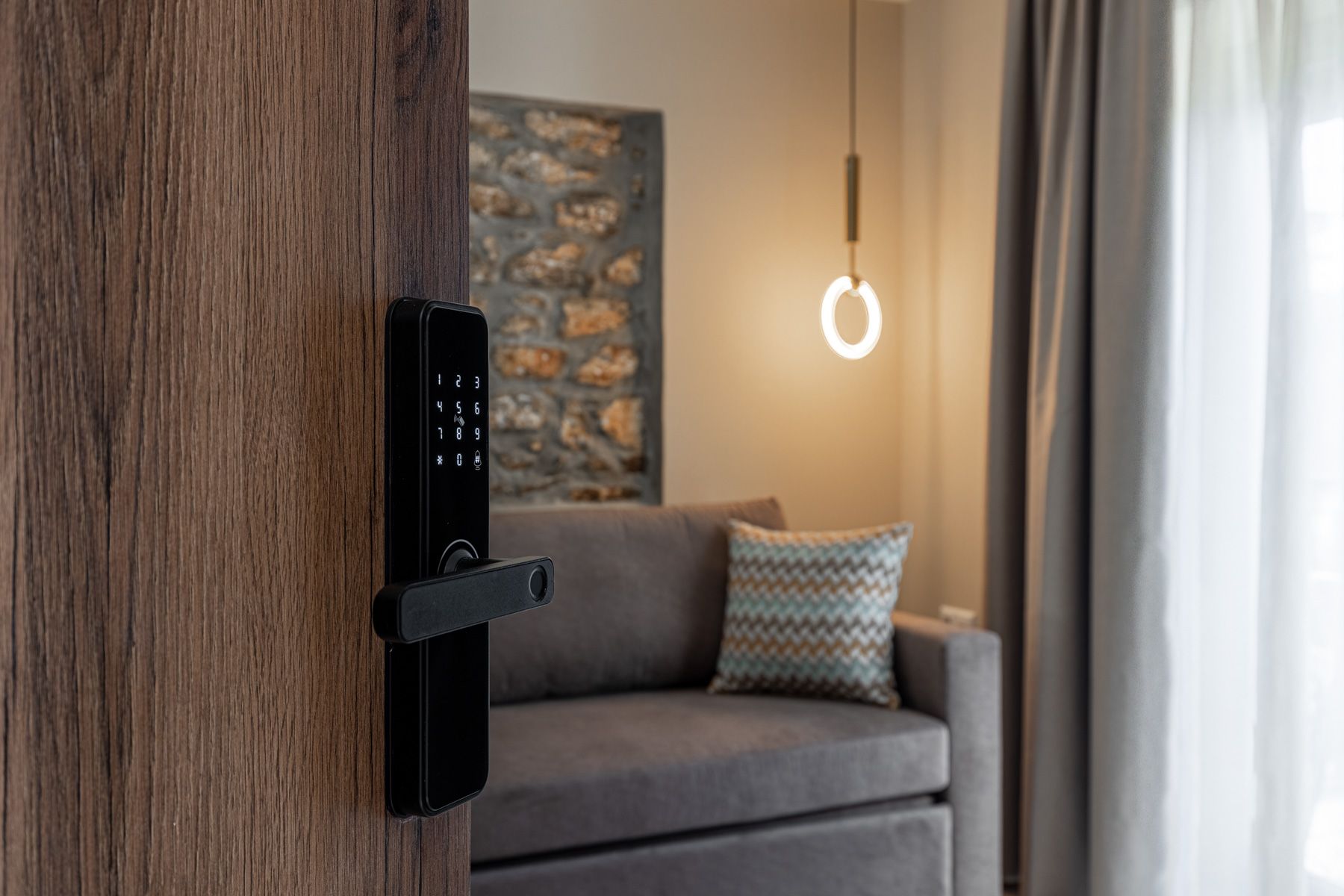 The keypad lock on Asteroessa's oak door, with the living room beyond